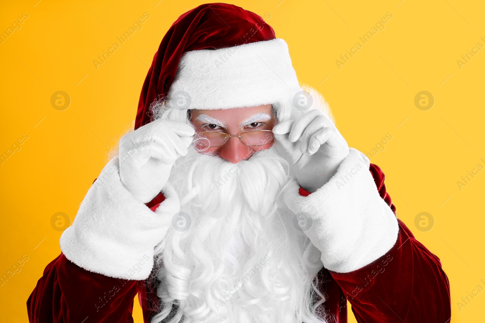 Photo of Portrait of Santa Claus on yellow background