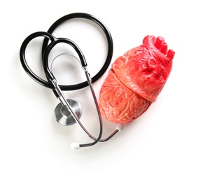 Photo of Stethoscope and model of heart on light background. Heart attack concept