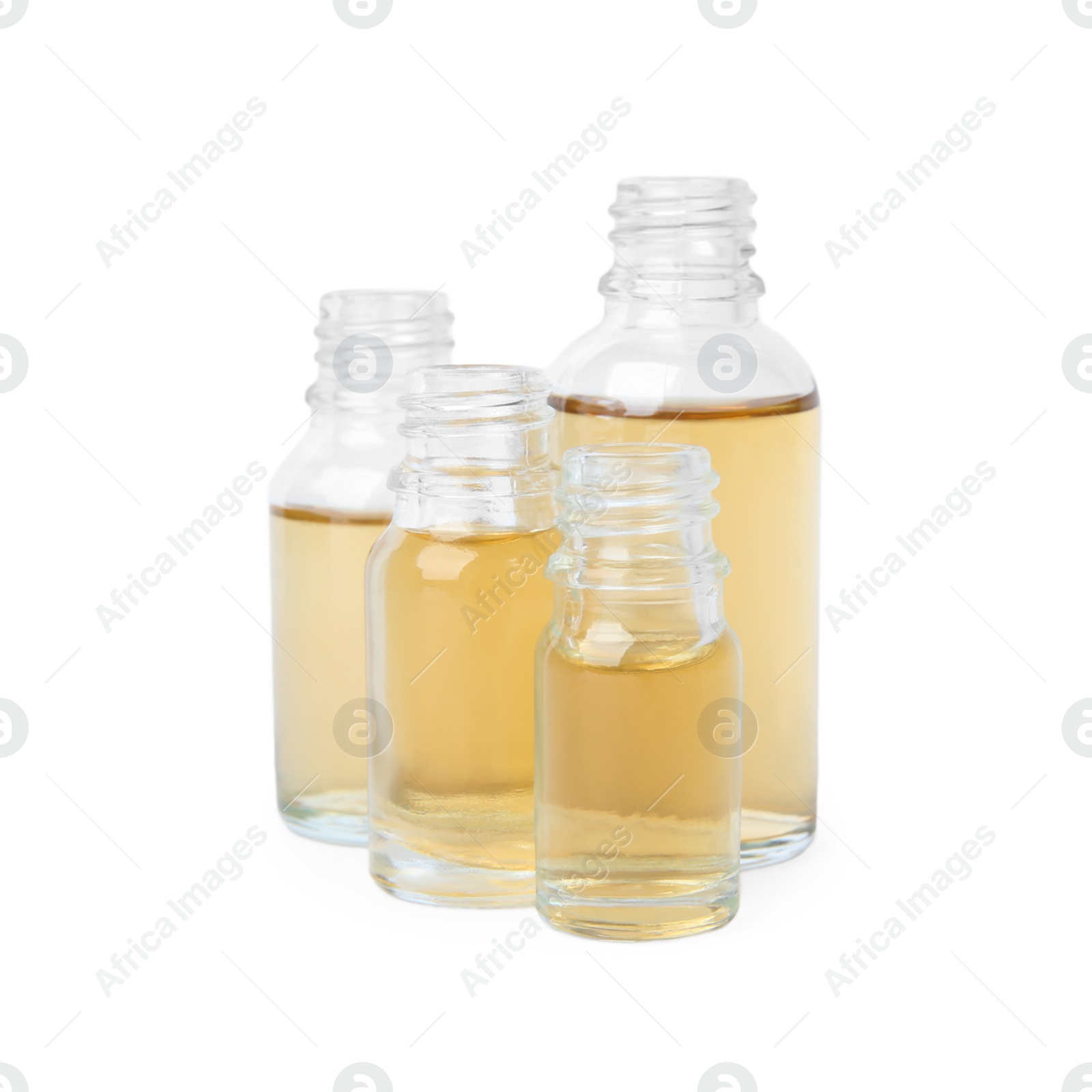 Photo of Glass bottles of essential oils on white background