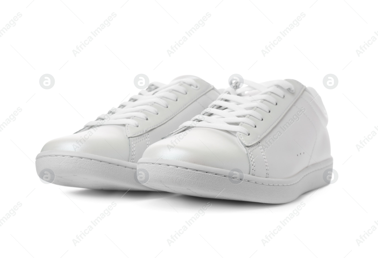 Photo of Pair of trendy sneakers on white background