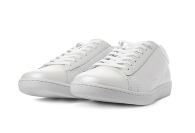 Pair of trendy sneakers on white background