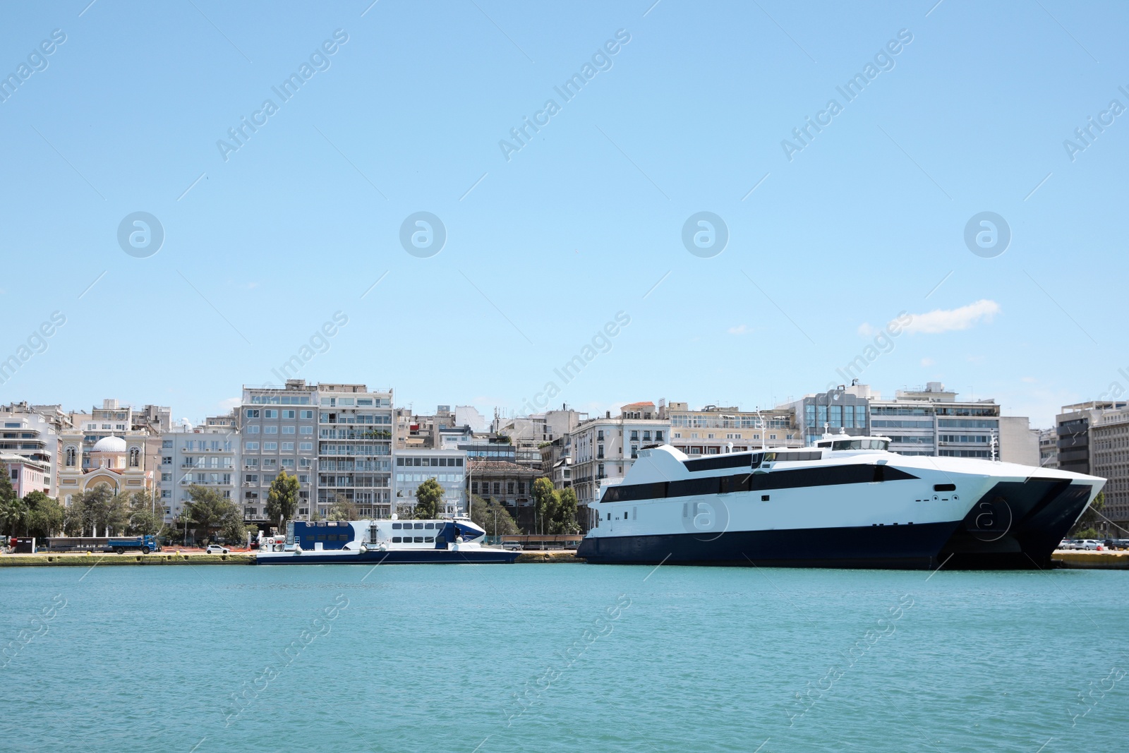 Photo of Modern ferry in sea port on sunny day