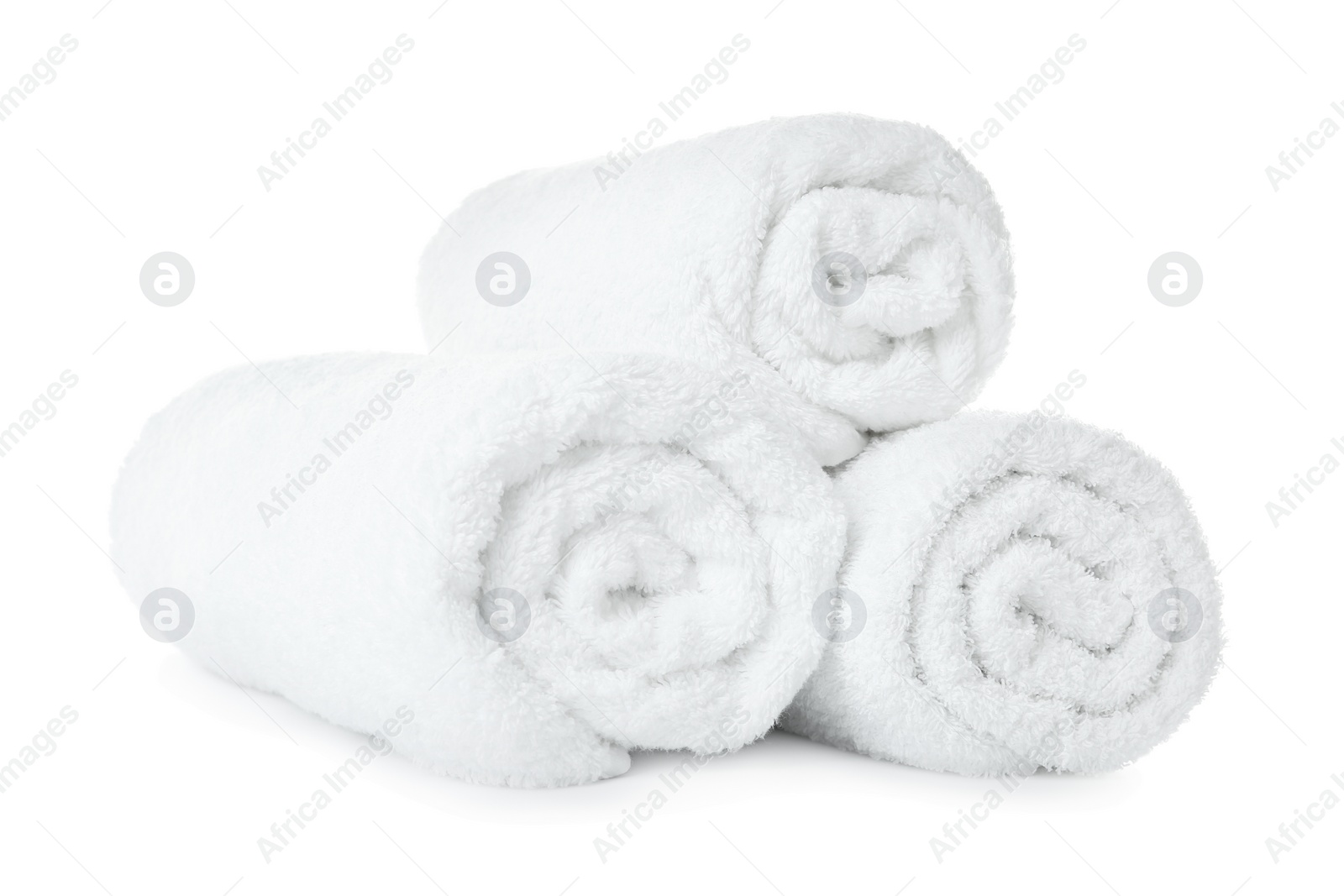 Photo of Rolled soft terry towels on white background