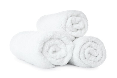 Rolled soft terry towels on white background