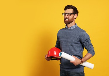 Photo of Professional engineer with hard hat and draft on yellow background, space for text
