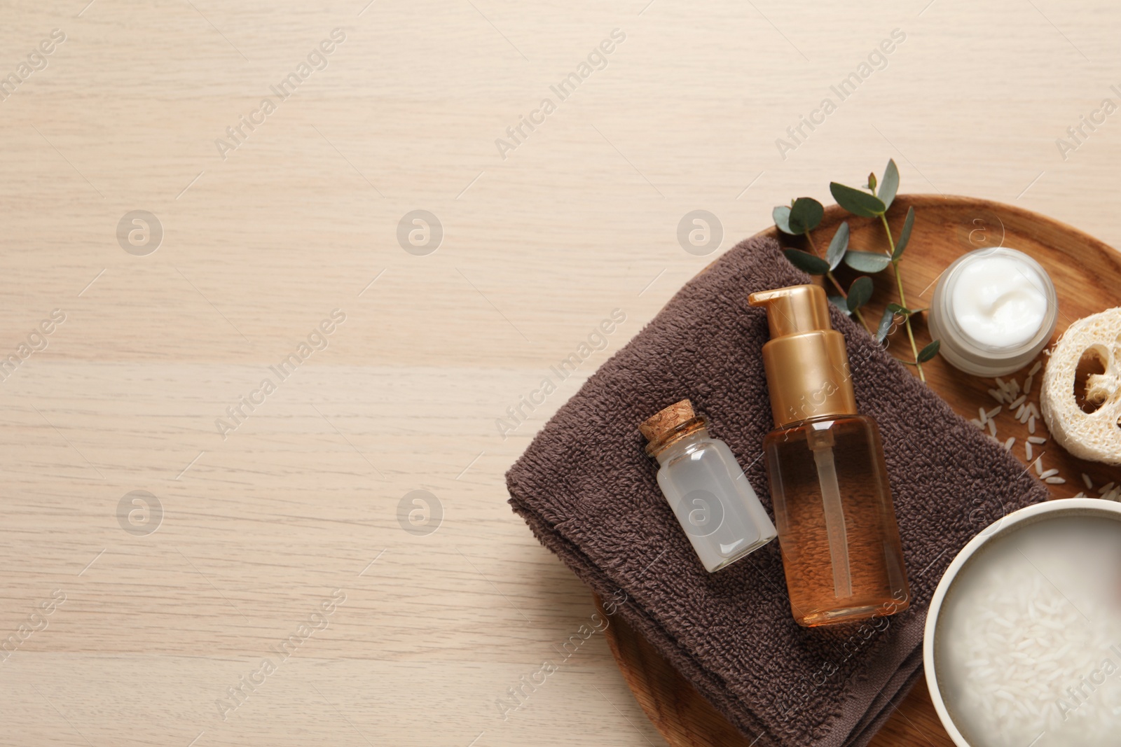 Photo of Flat lay composition with soaked rice on wooden table. Space for text