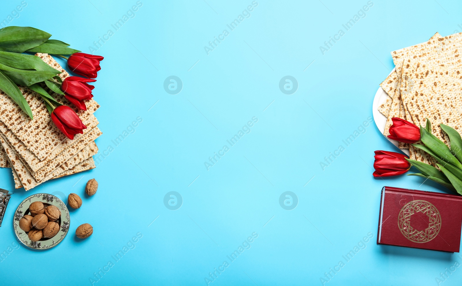 Photo of Flat lay composition with matzos on light blue background, space for text. Passover (Pesach) celebration