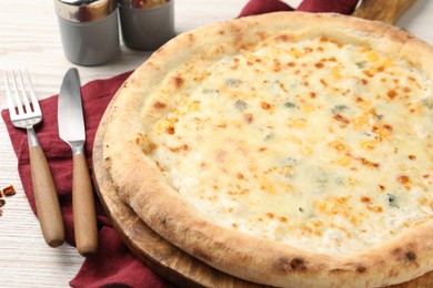 Photo of Delicious cheese pizza served on white wooden table, closeup