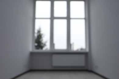 Photo of Blurred view of window in empty renovated room