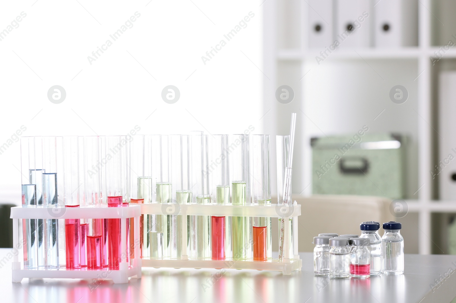 Photo of Laboratory glassware on table indoors. Research and analysis