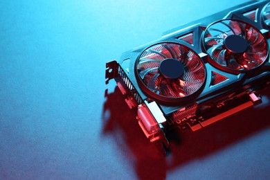 Photo of Computer graphics card on color background, closeup. Space for text