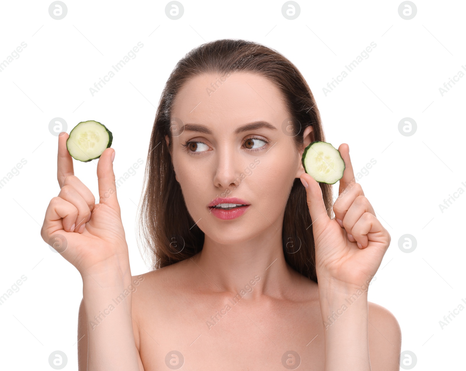 Photo of Beautiful woman with pieces of cucumber on white background