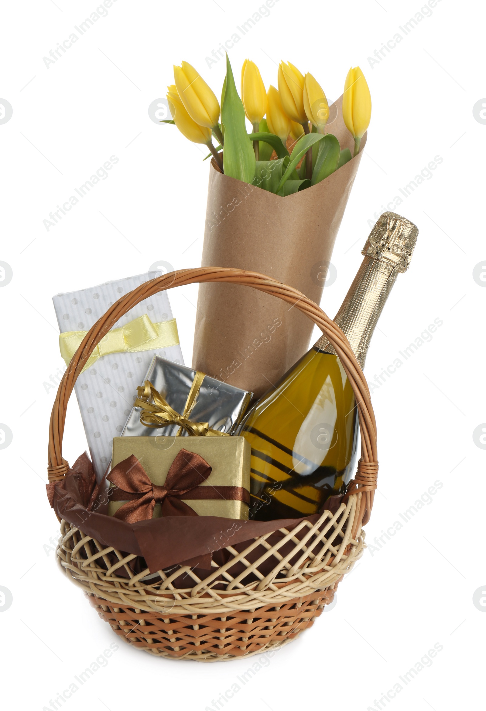 Photo of Wicker basket full of presents isolated on white