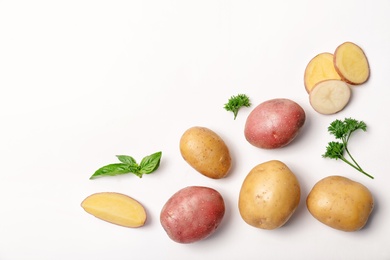 Photo of Flat lay composition with fresh organic potatoes and space for text on white background