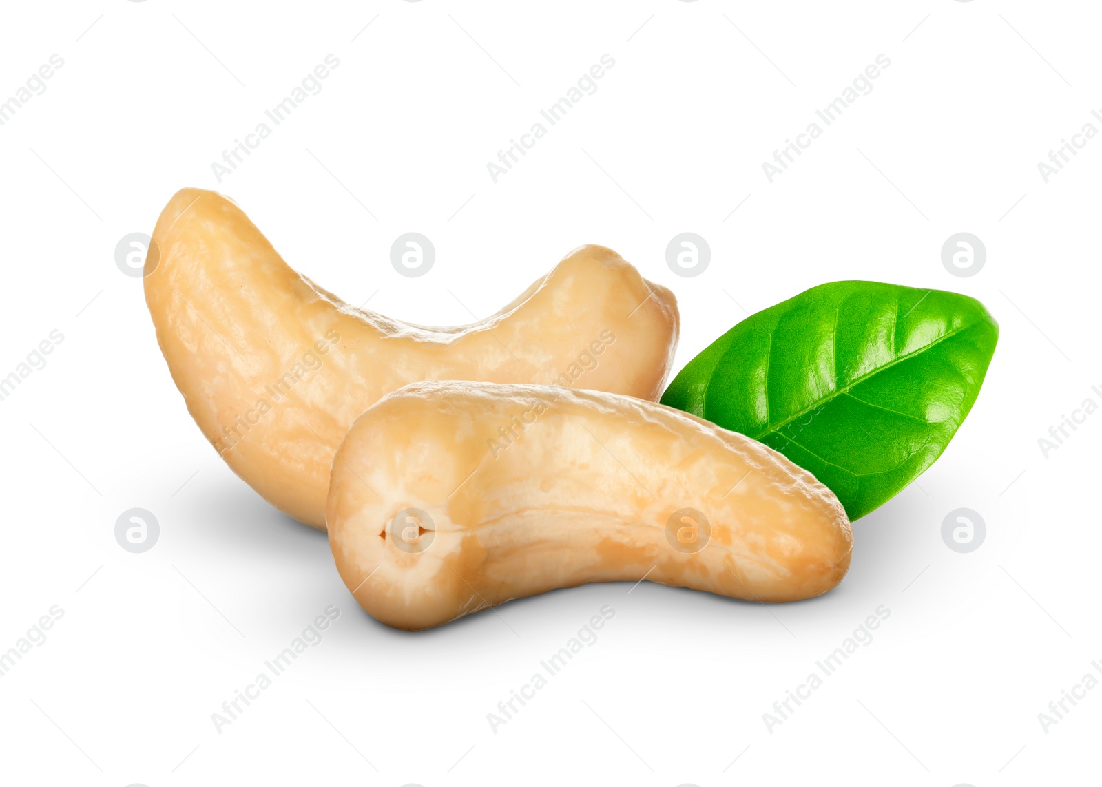 Image of Tasty cashew nuts and fresh green leaf on white background 