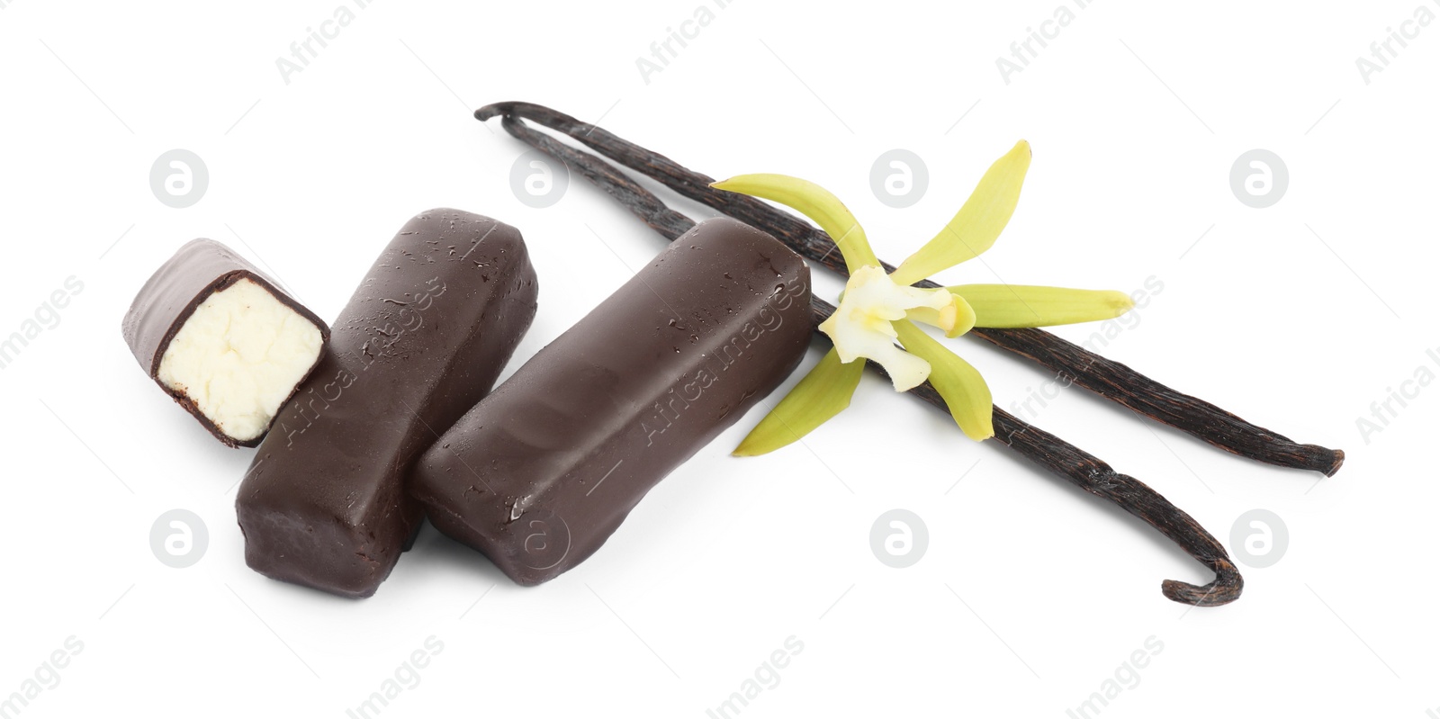 Photo of Glazed curd cheese bars, vanilla pods and flower isolated on white