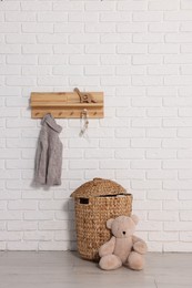 Beautiful children's room with white brick wall and toys. Interior design