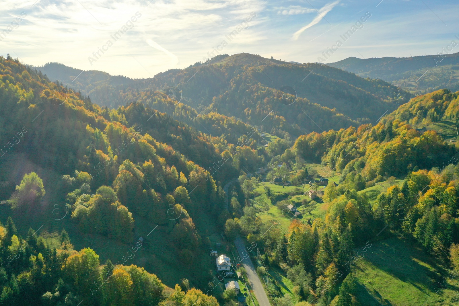 Photo of Aerial view of beautiful mountain forest and village on autumn day