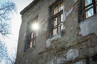 Photo of Exterior of ruined house after strong earthquake, low angle view