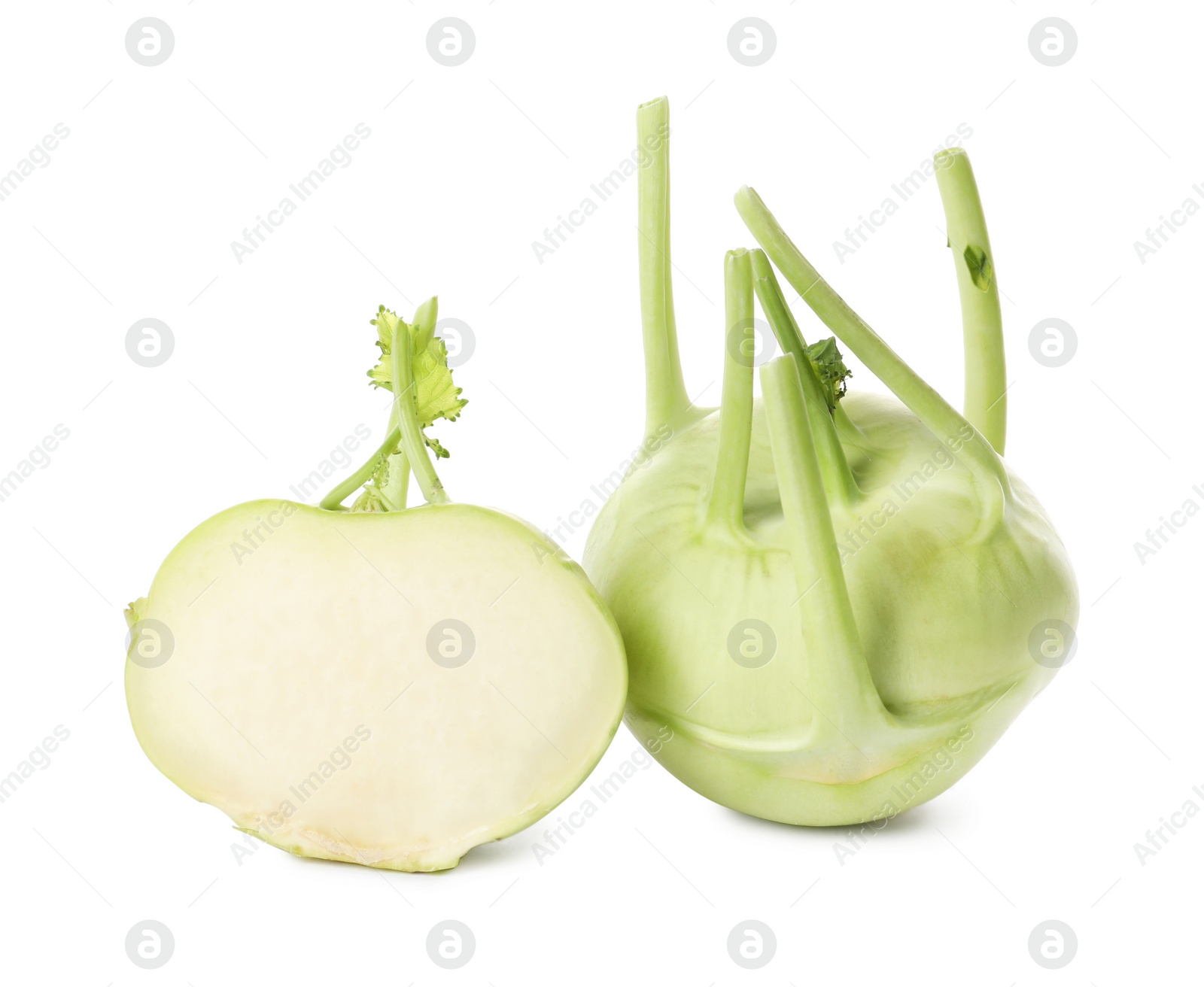 Photo of Whole and cut kohlrabi plants on white background