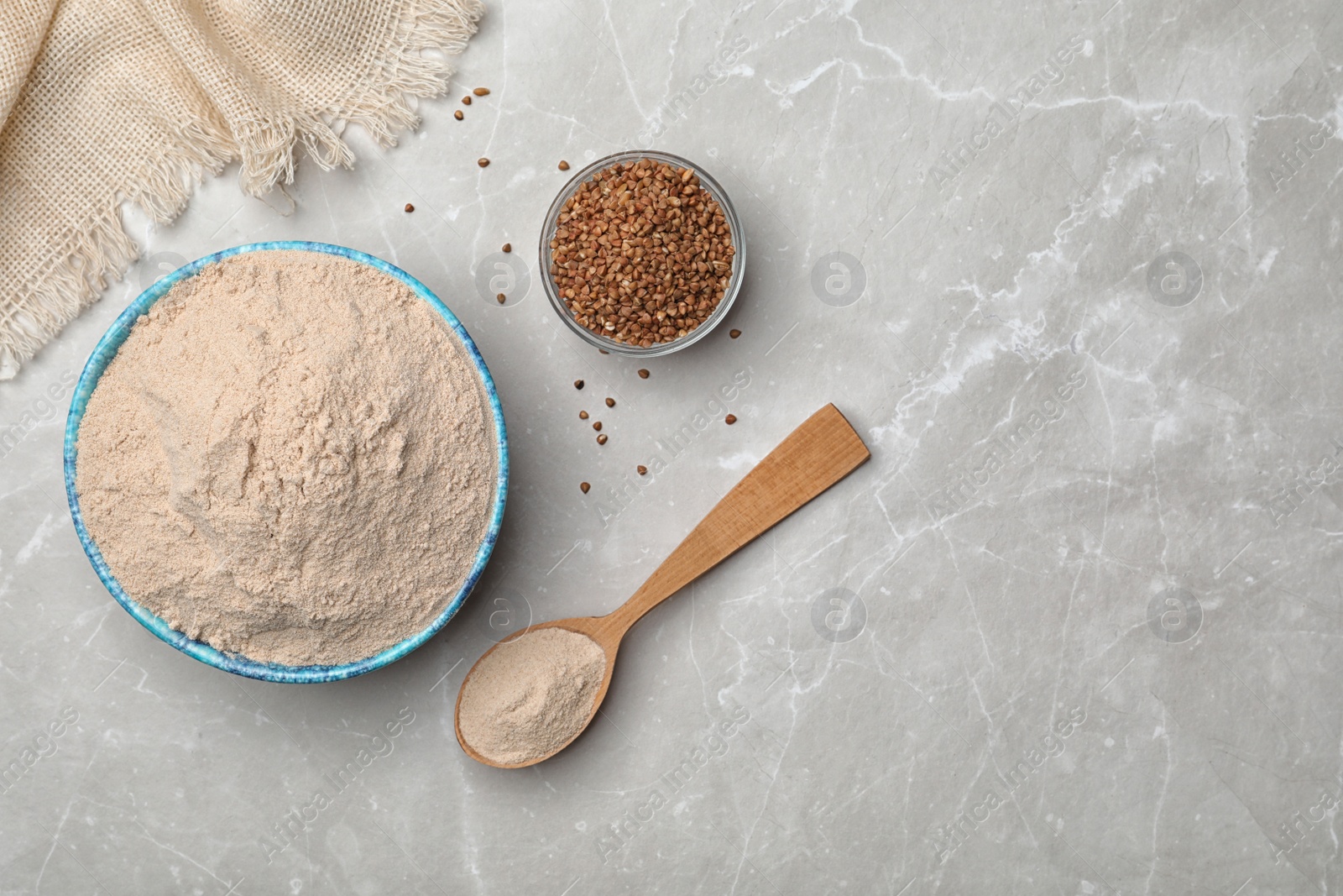 Photo of Composition with buckwheat flour on light background