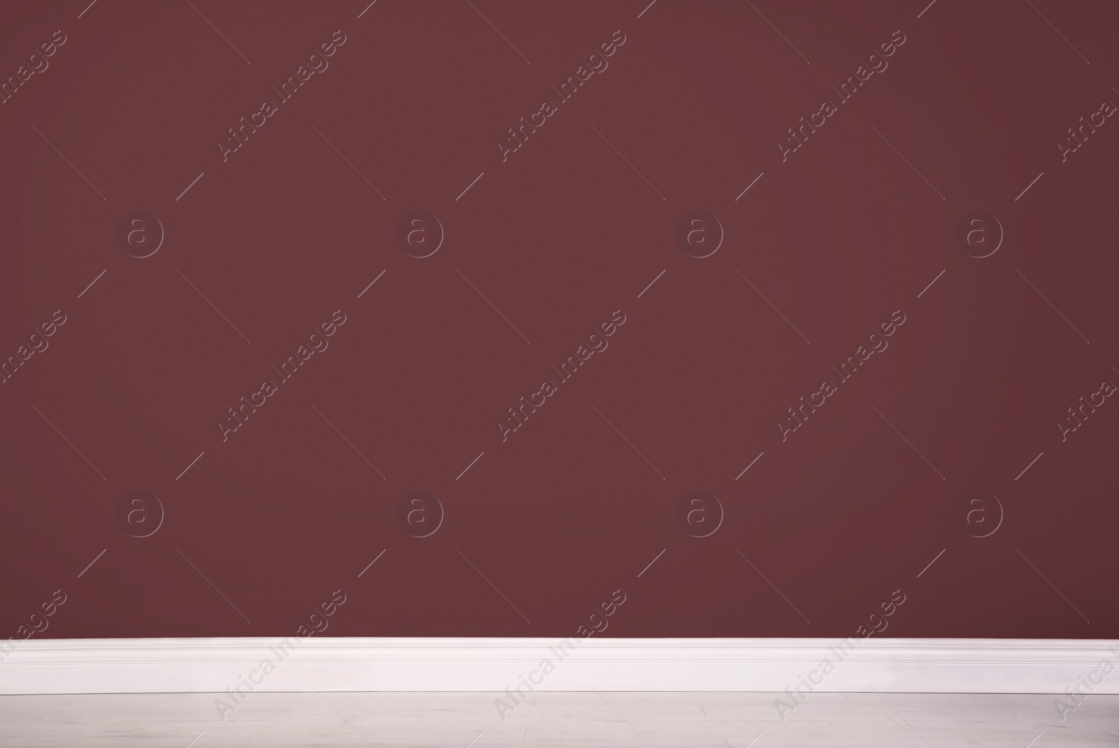 Photo of Blank burgundy wall in room. Space for design