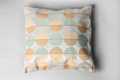 Soft decorative pillow on light background