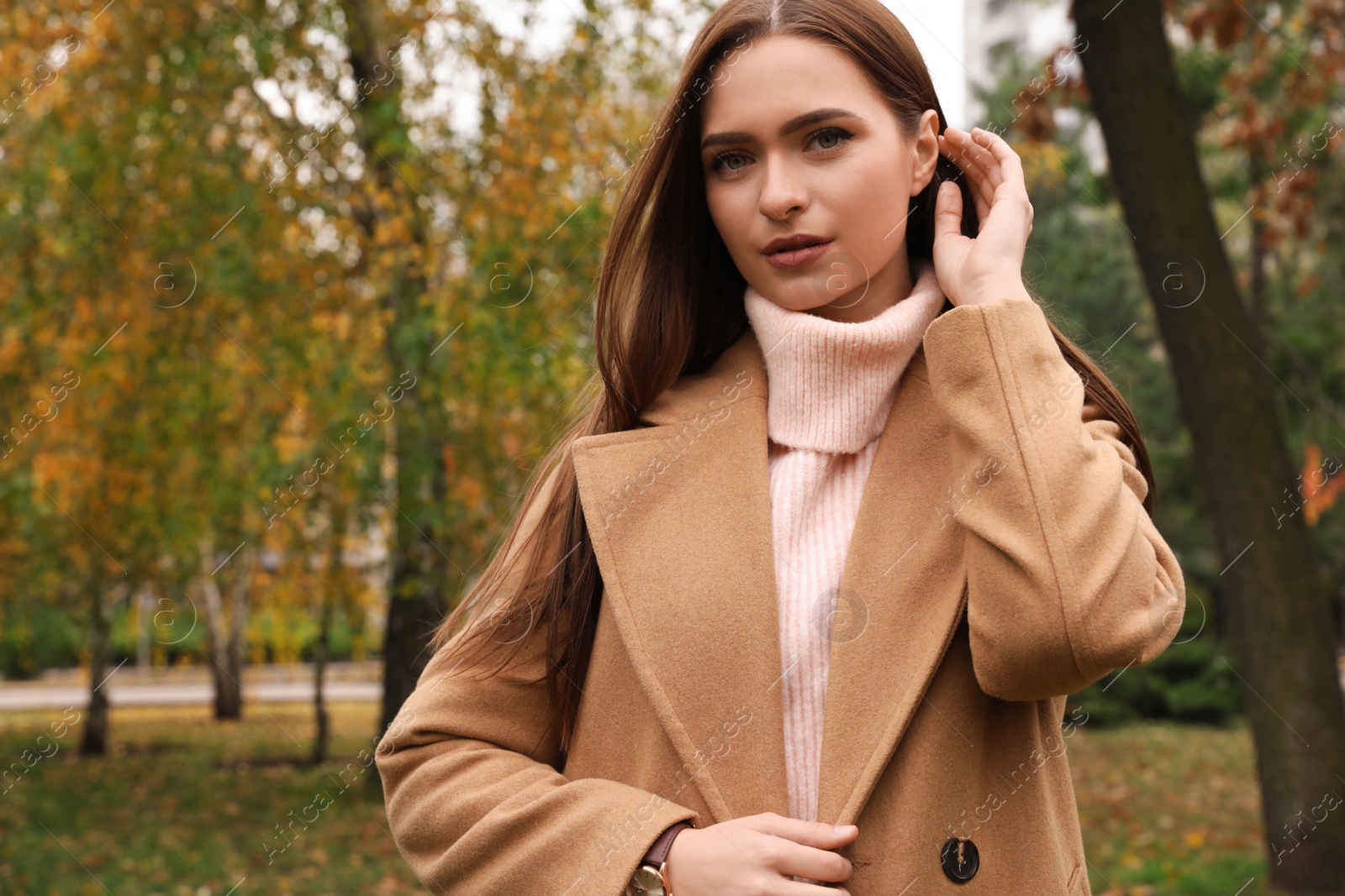 Photo of Beautiful young woman wearing stylish clothes in autumn park