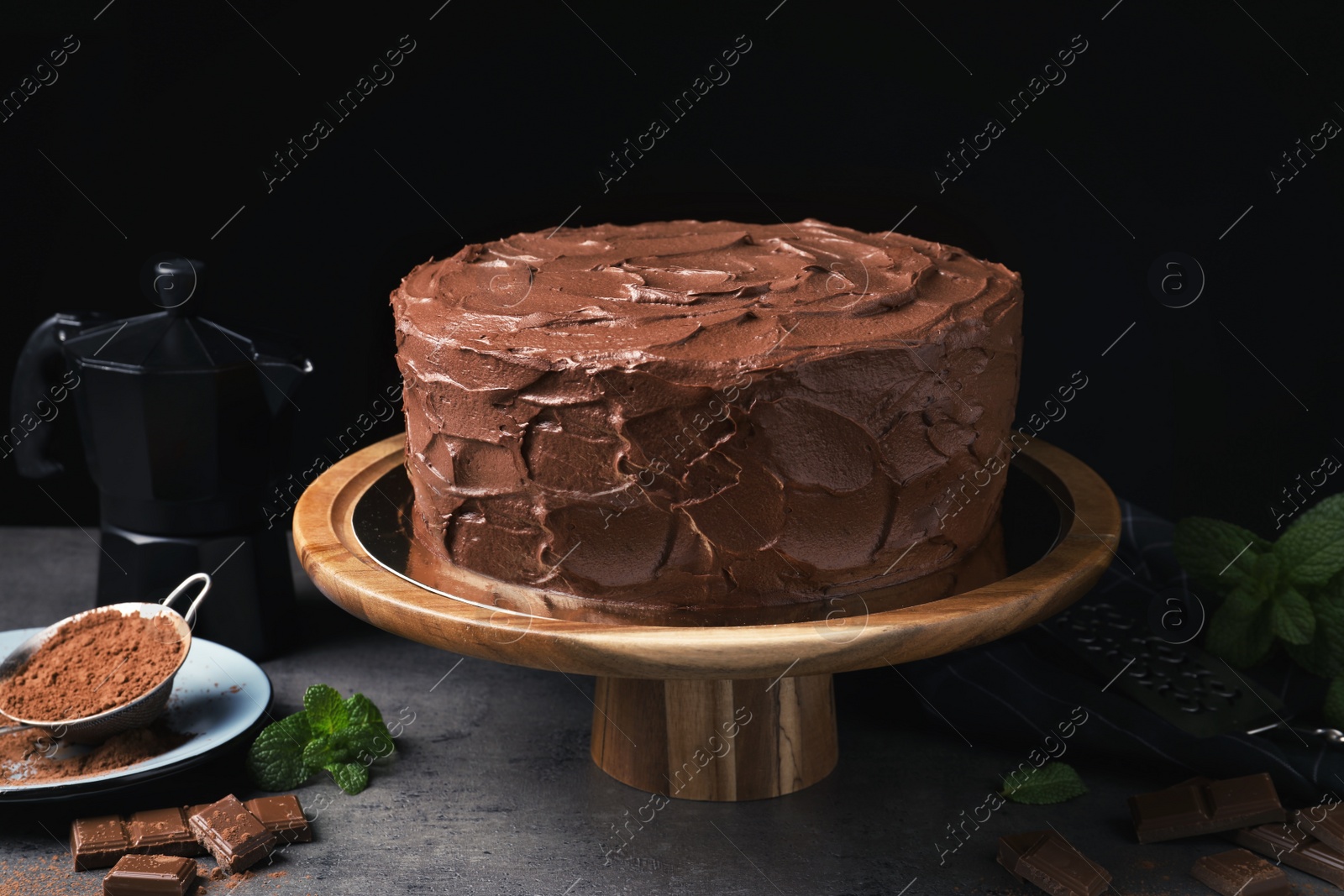 Photo of Composition with tasty homemade chocolate cake on table