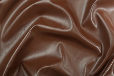 Photo of Brown natural leather as background, top view