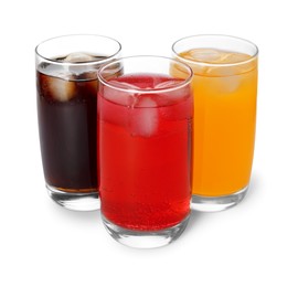 Glasses of different refreshing soda water with ice cubes on white background