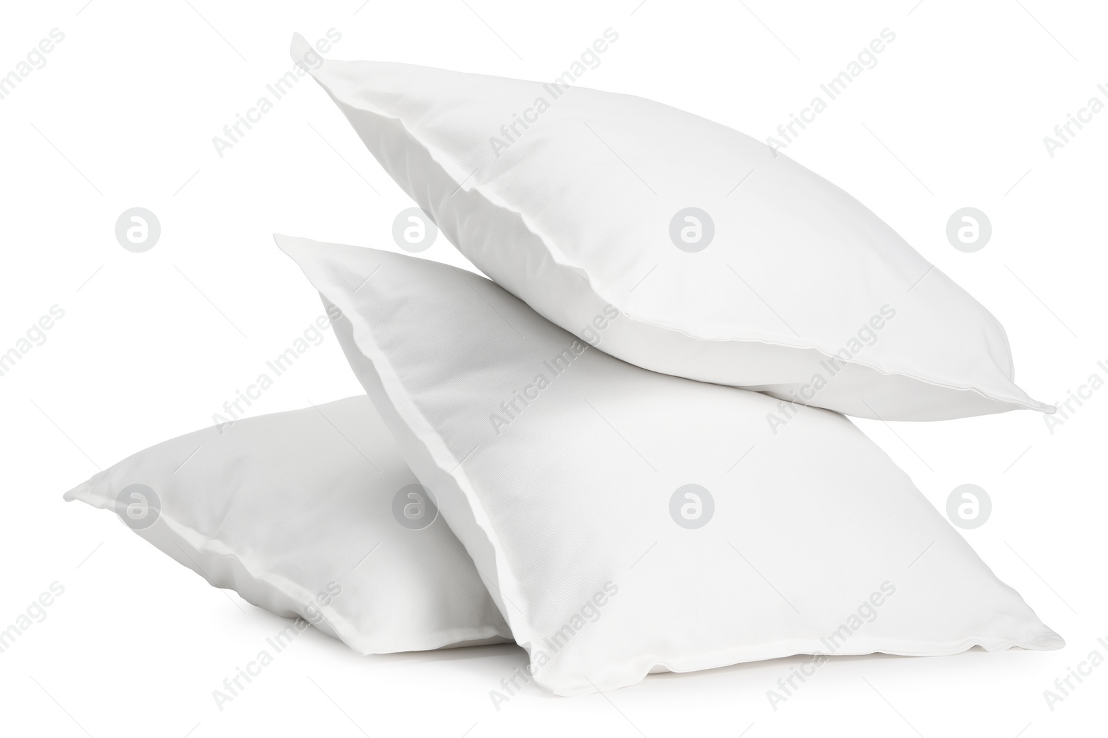 Photo of Three new soft pillows isolated on white