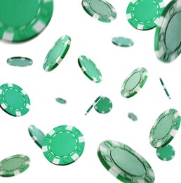 Image of Green casino chips falling on white background