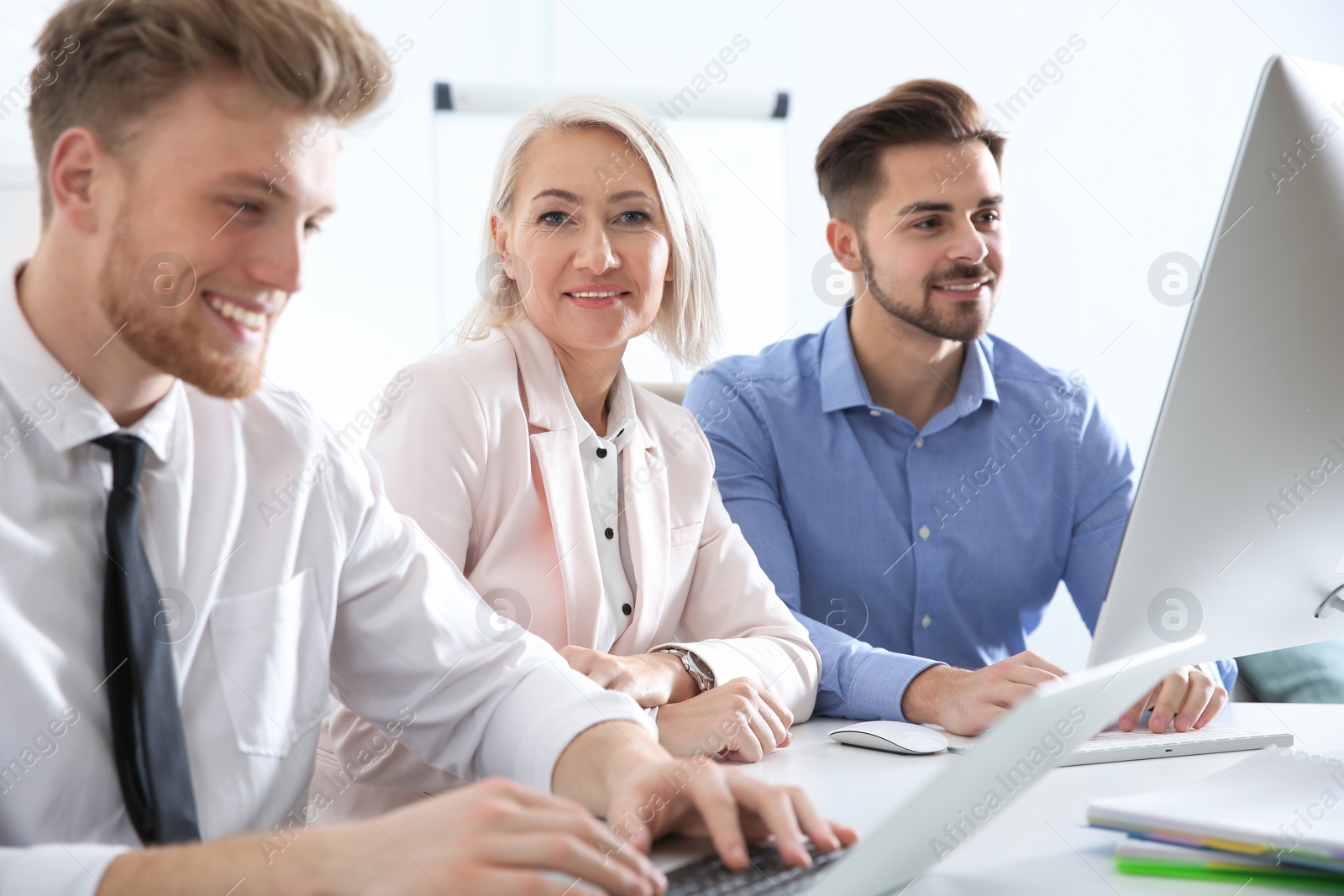 Photo of Business people working at table. Professional communication