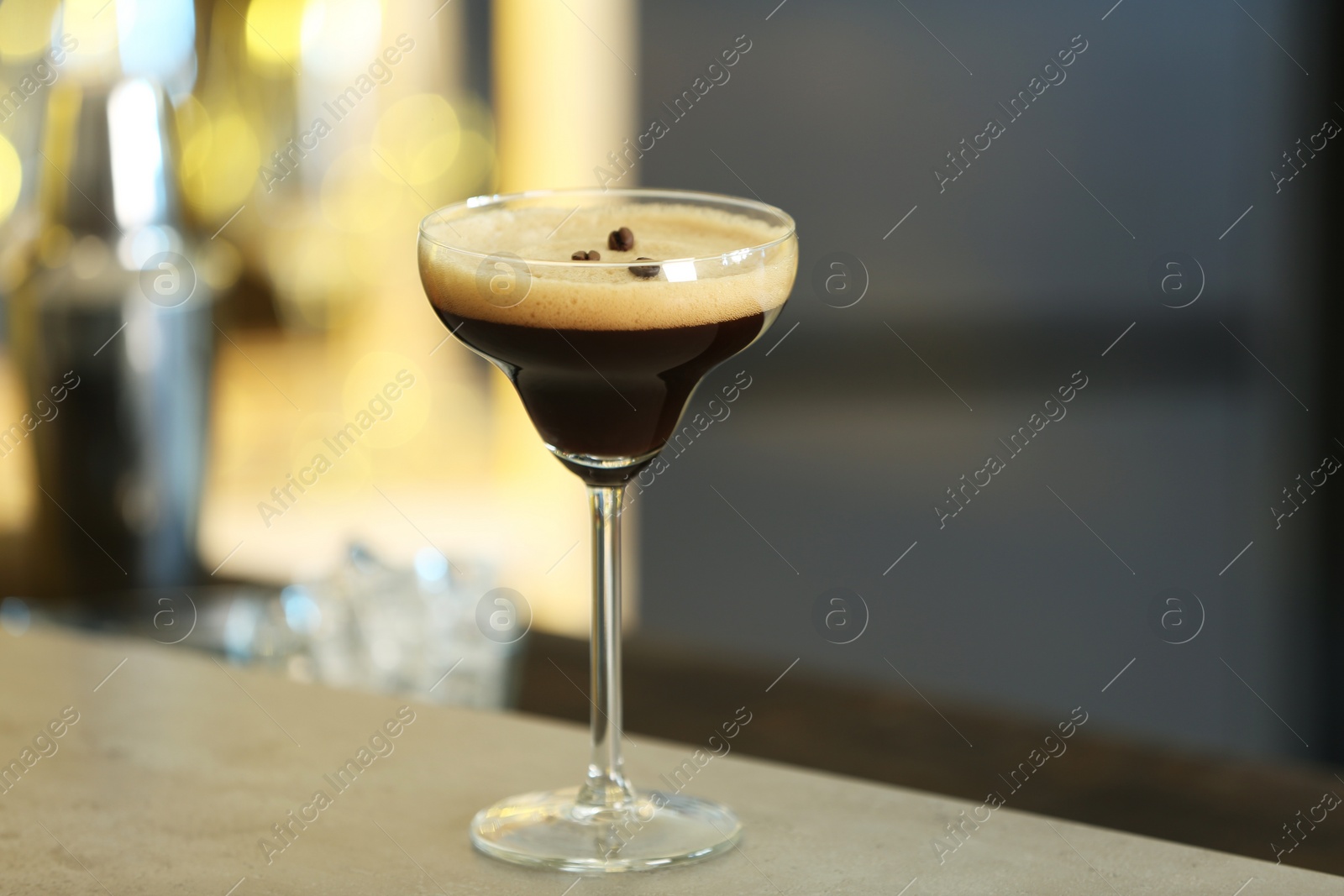 Photo of Fresh alcoholic Martini Espresso cocktail on bar counter