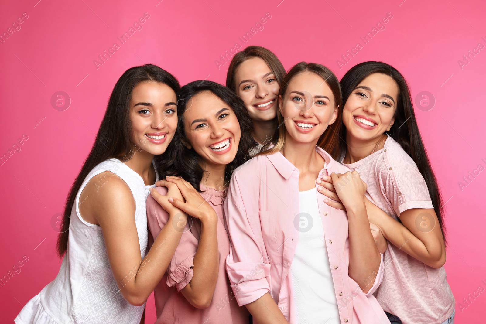 Photo of Happy women on pink background. Girl power concept