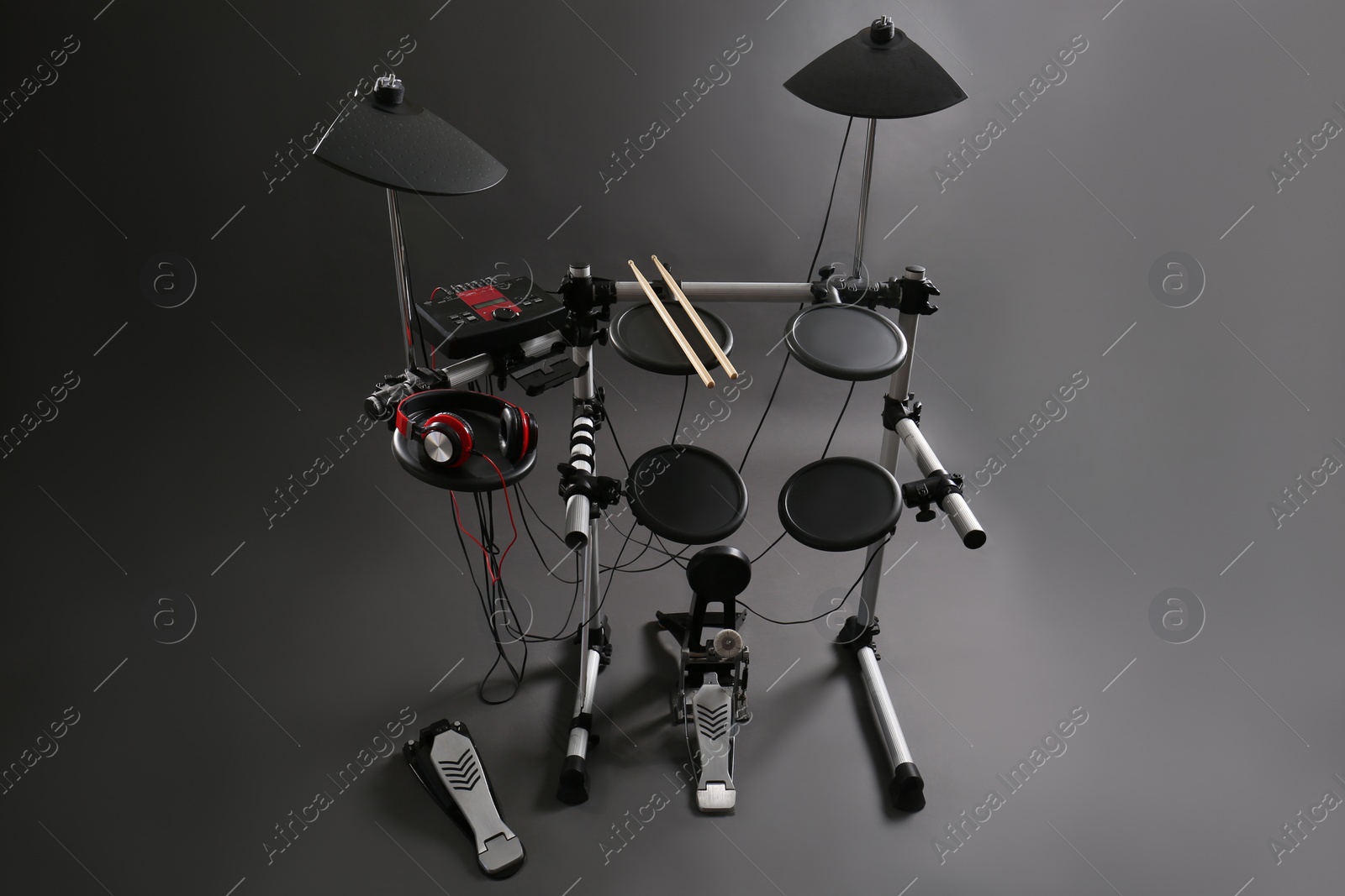 Photo of Modern electronic drum kit on grey background. Musical instrument