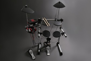 Photo of Modern electronic drum kit on grey background. Musical instrument