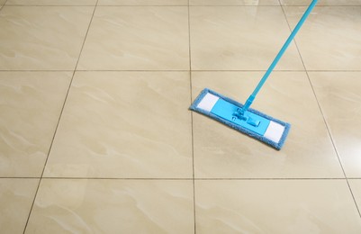 Washing of floor with mop. Space for text