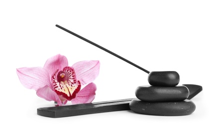 Photo of Incense stick in holder near orchid flower and spa stones on white background