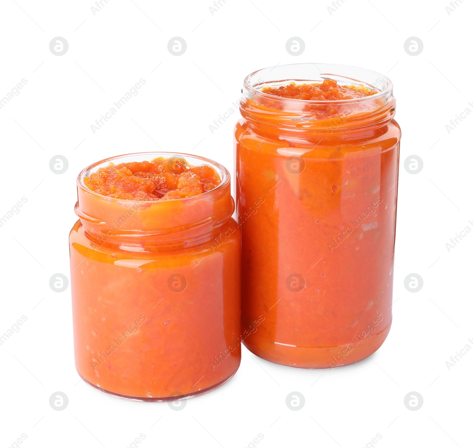 Photo of Jars of delicious pumpkin jam isolated on white