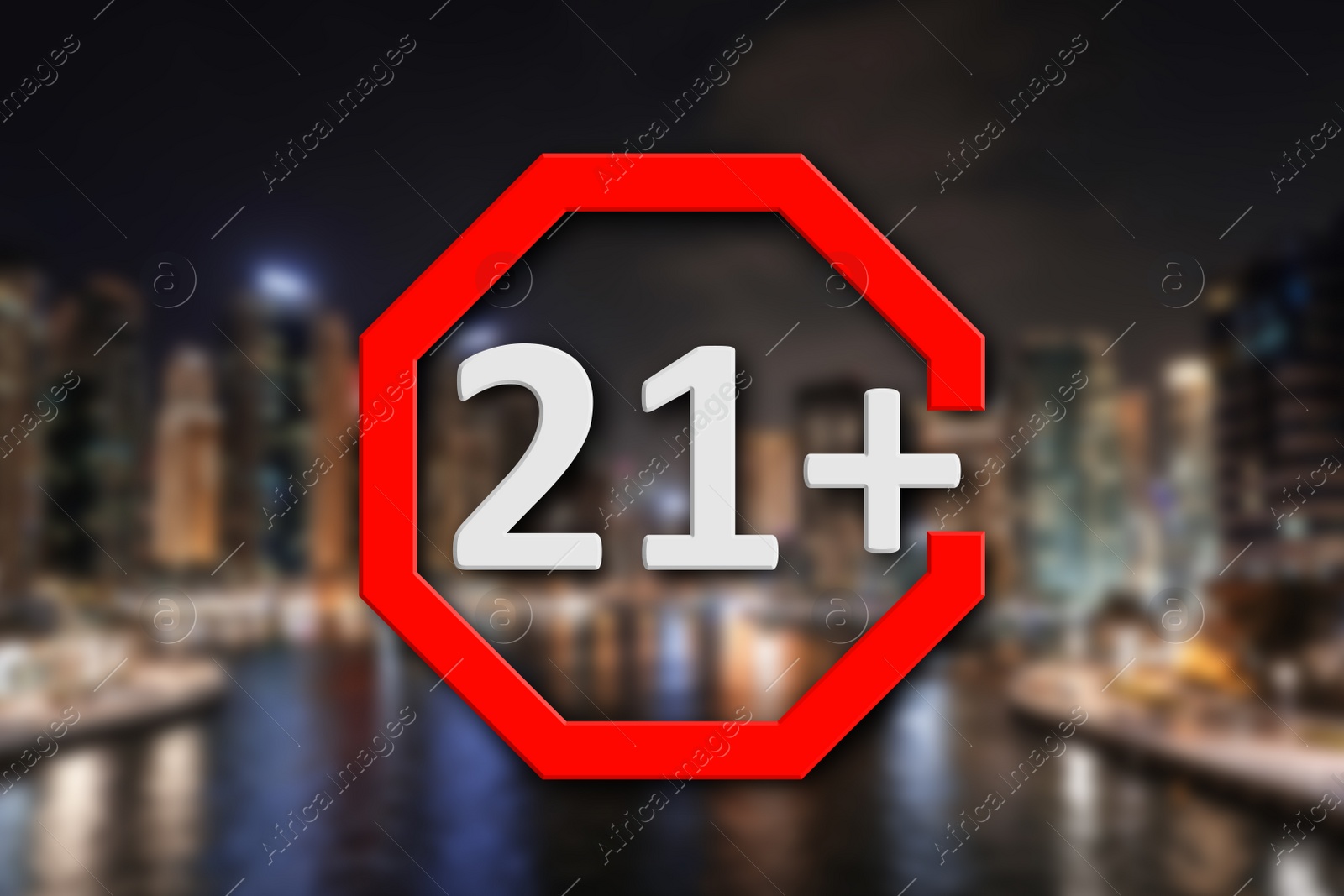 Image of Age limit sign 21+ years and blurred view of night city