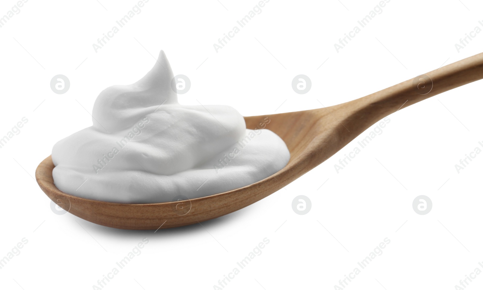 Photo of Wooden spoon with sour cream isolated on white