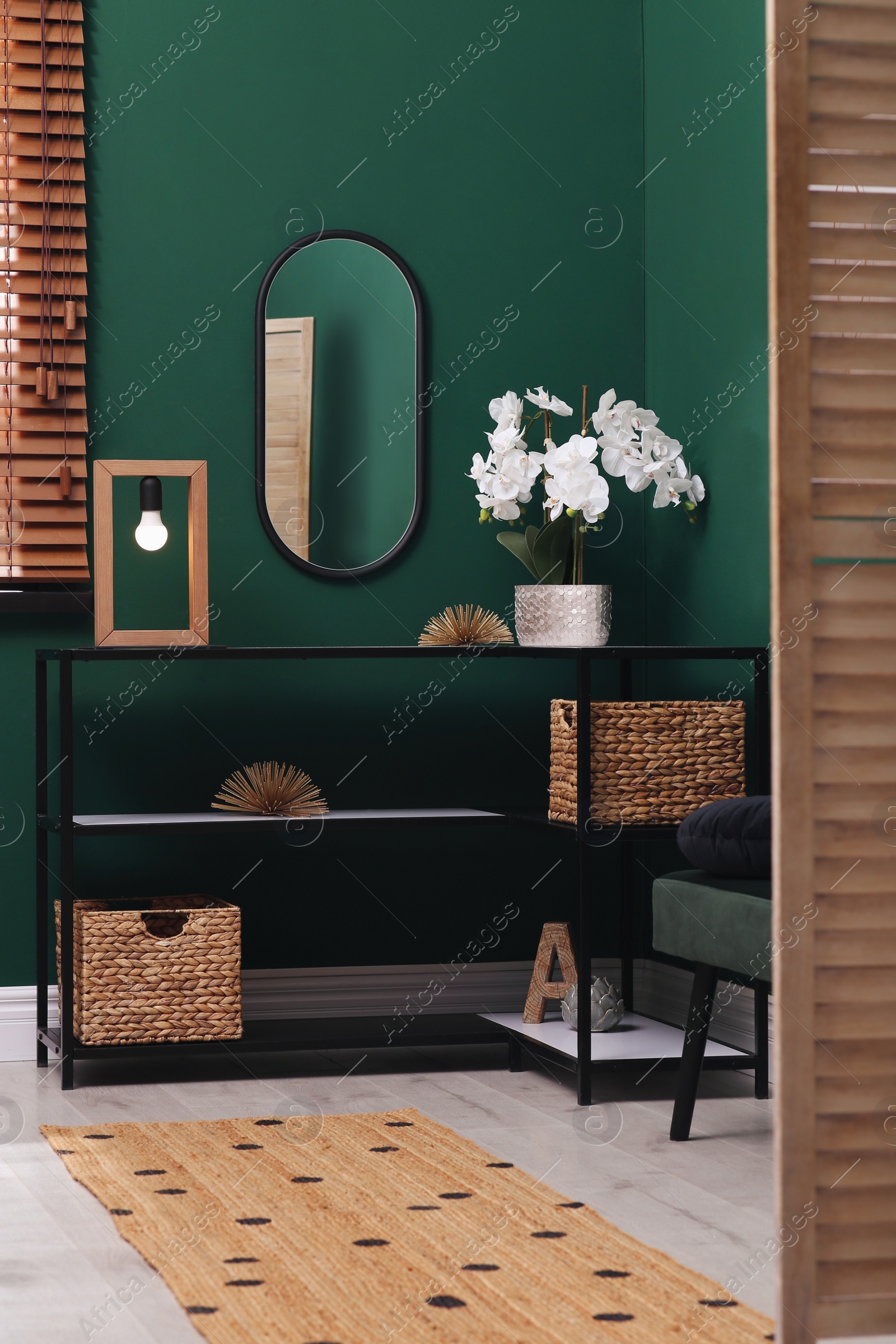 Photo of Modern hallway interior with console table and beautiful orchid flower