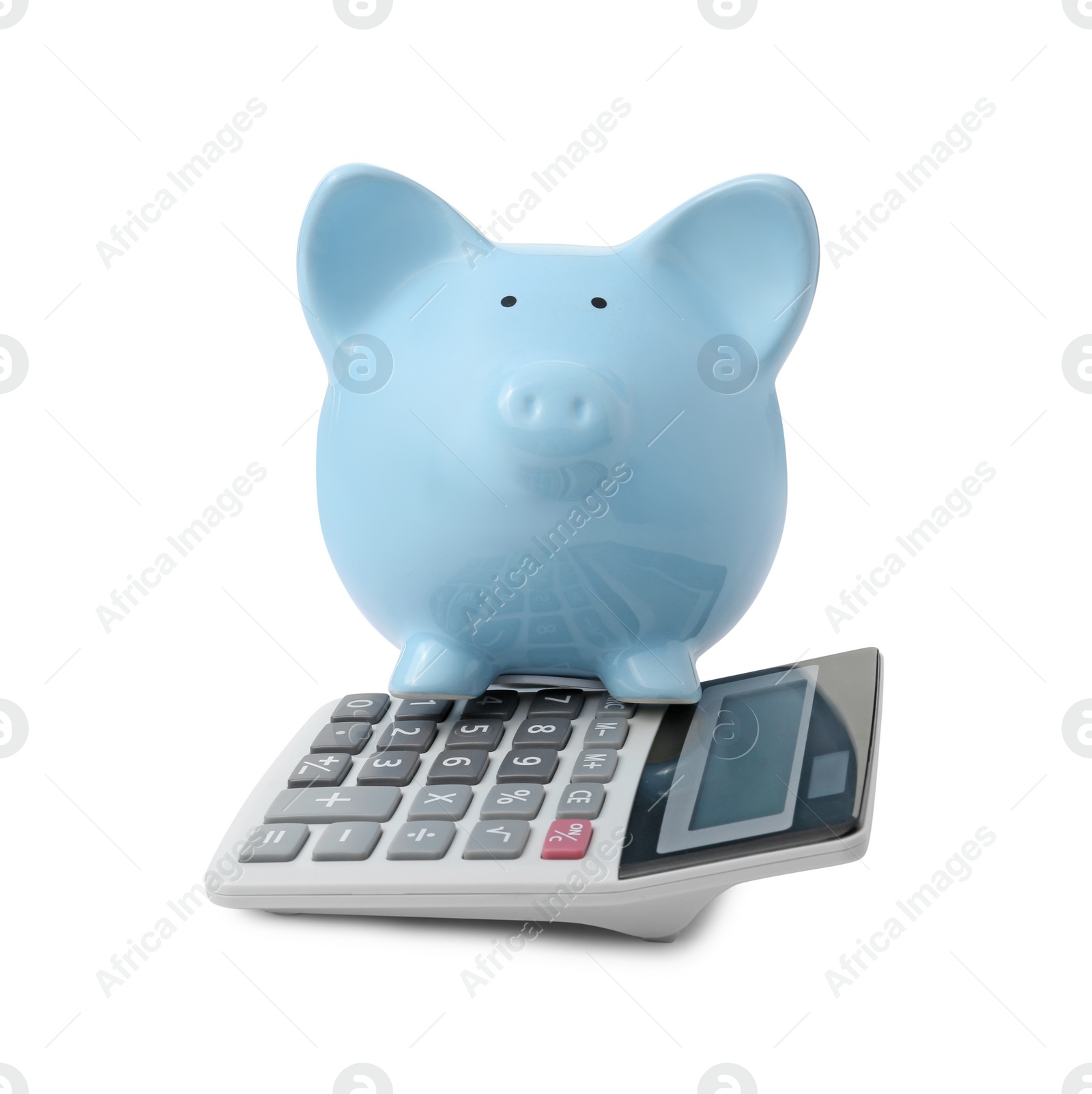 Photo of Calculator and piggy bank isolated on white