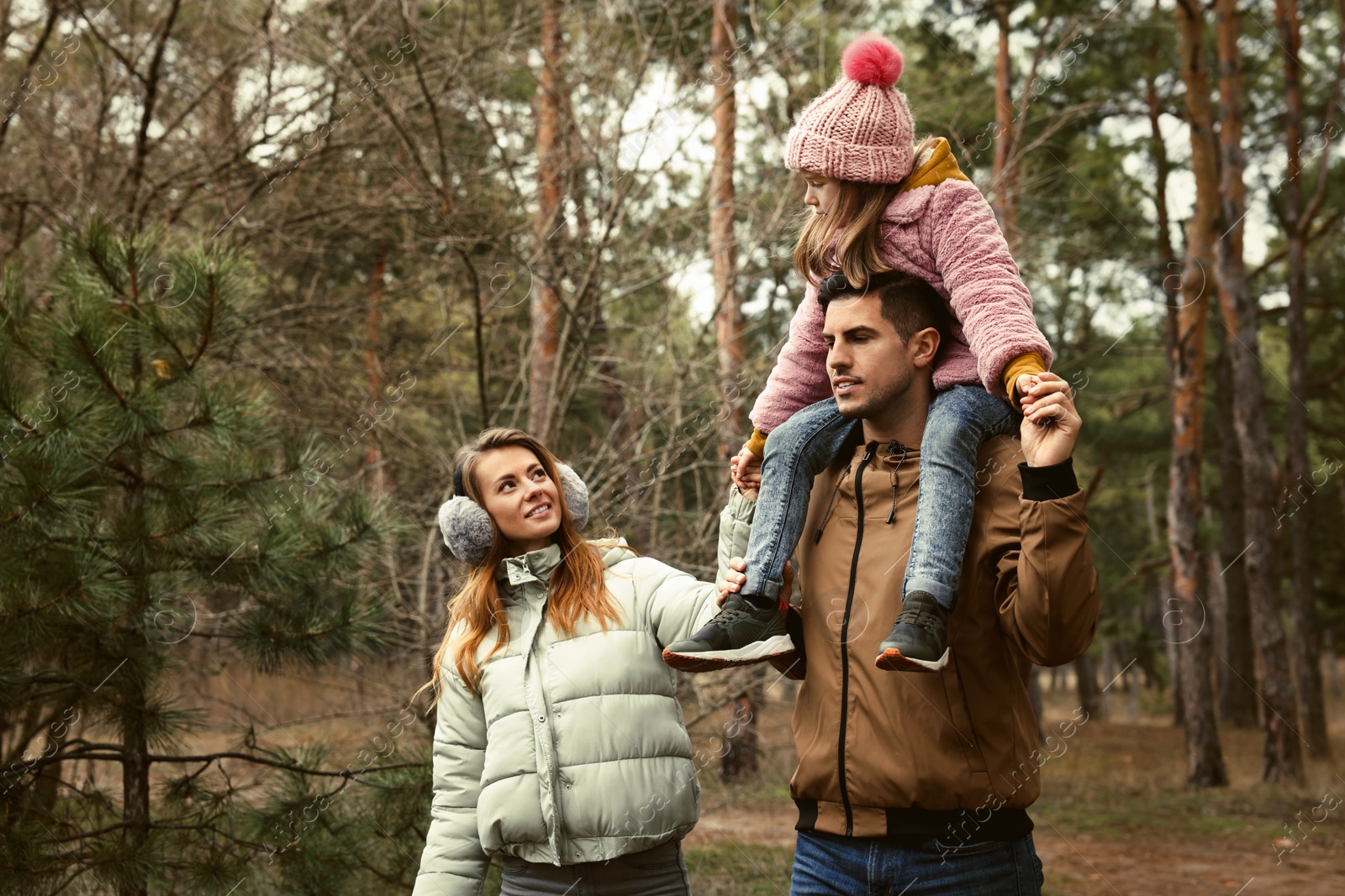 Photo of Happy family spending time together in forest