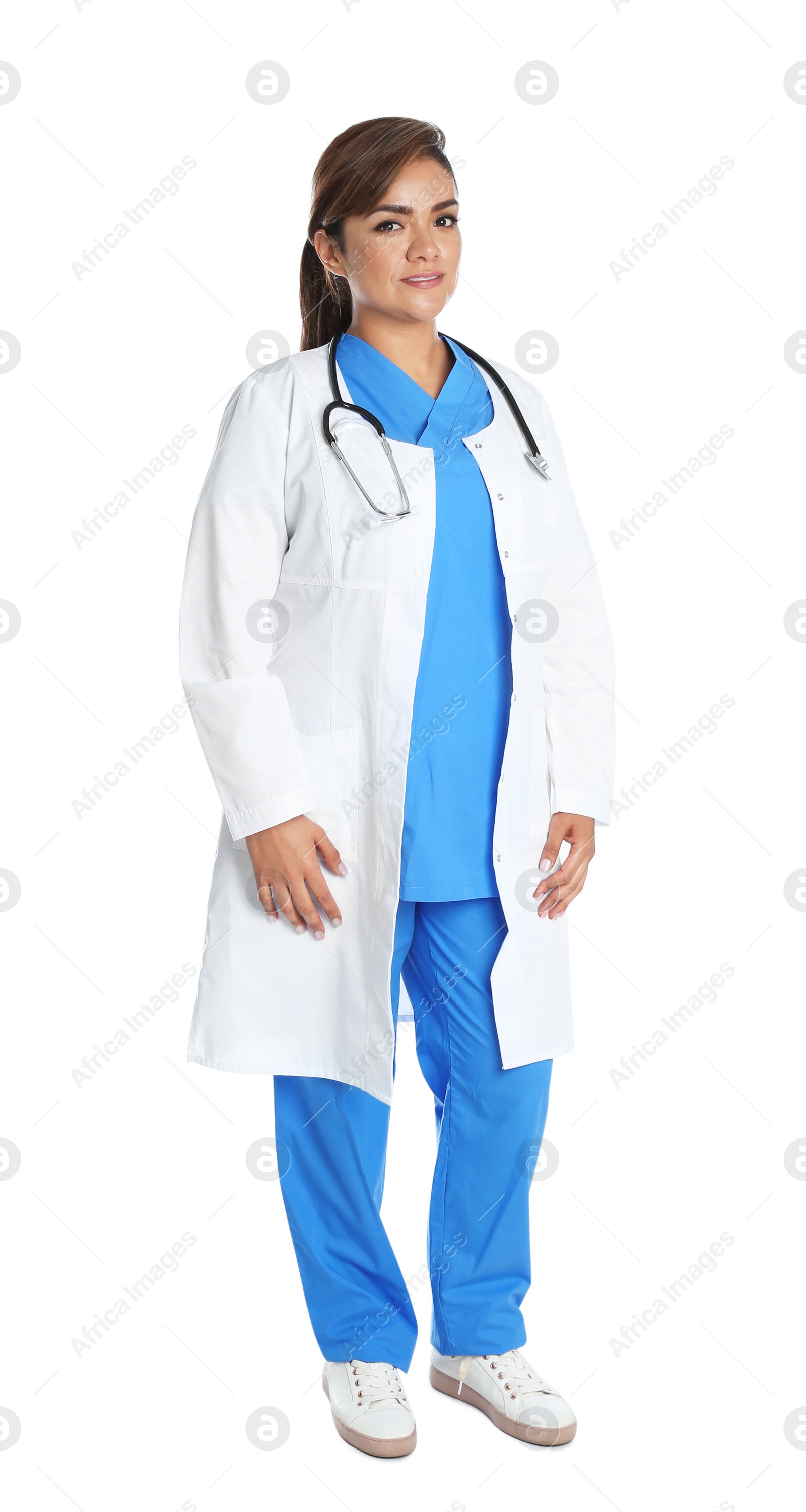 Photo of Full length portrait of female Hispanic doctor isolated on white. Medical staff