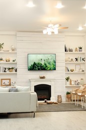 Photo of Cozy living room interior with decorative fireplace