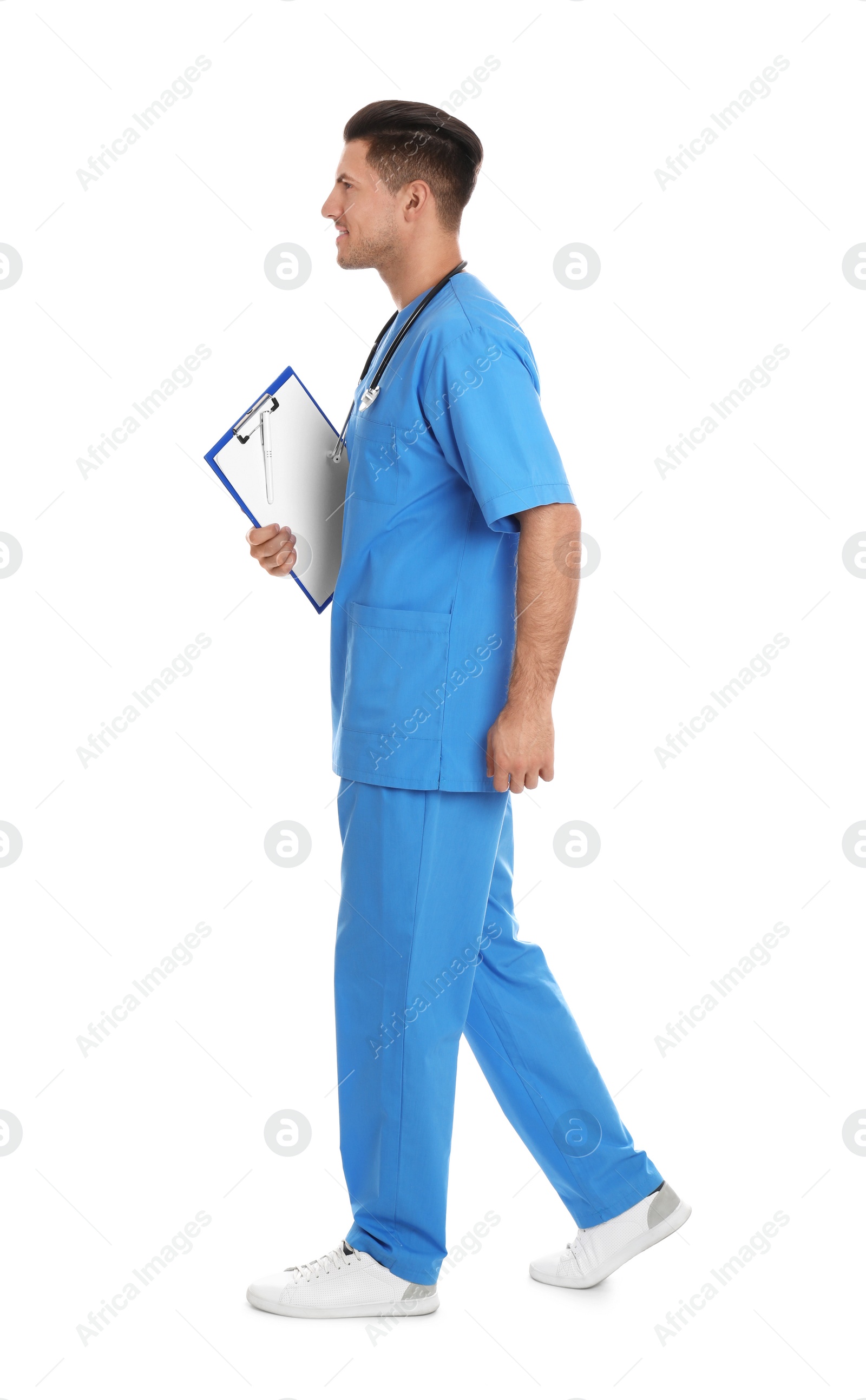 Photo of Doctor with clipboard walking on white background