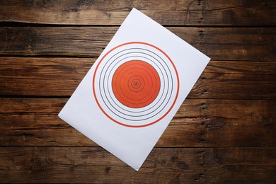 Photo of Shooting target on wooden table, top view